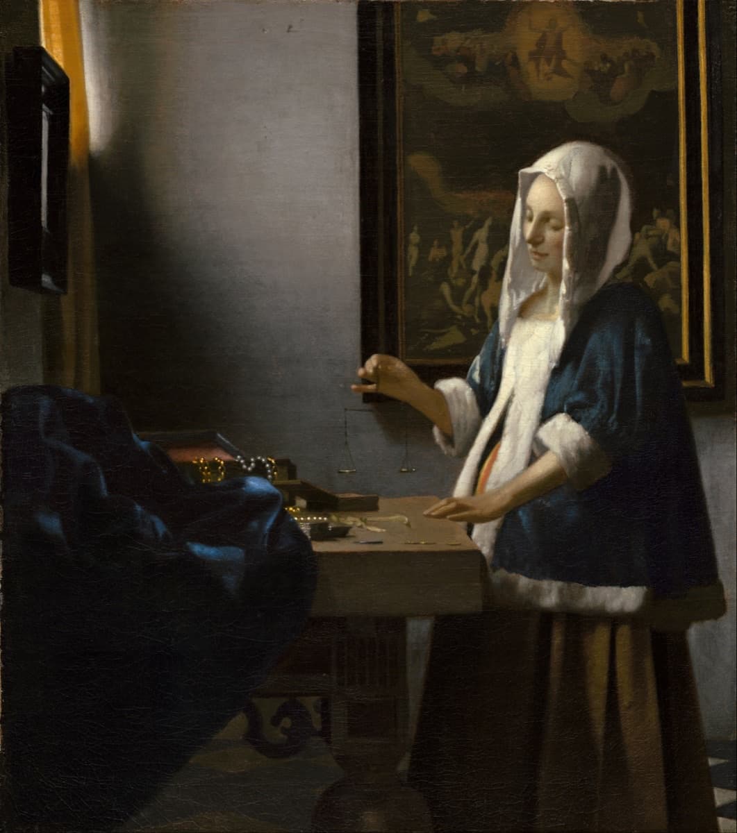 Woman Holding a Balance by Vermeer